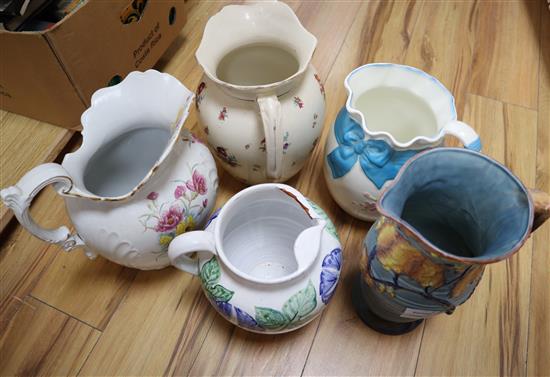 A Carltonware jug and four other ceramic jugs, tallest 31cm